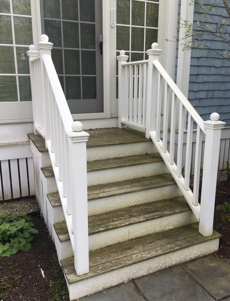 Dirty, moldy wooden steps in need of restoration