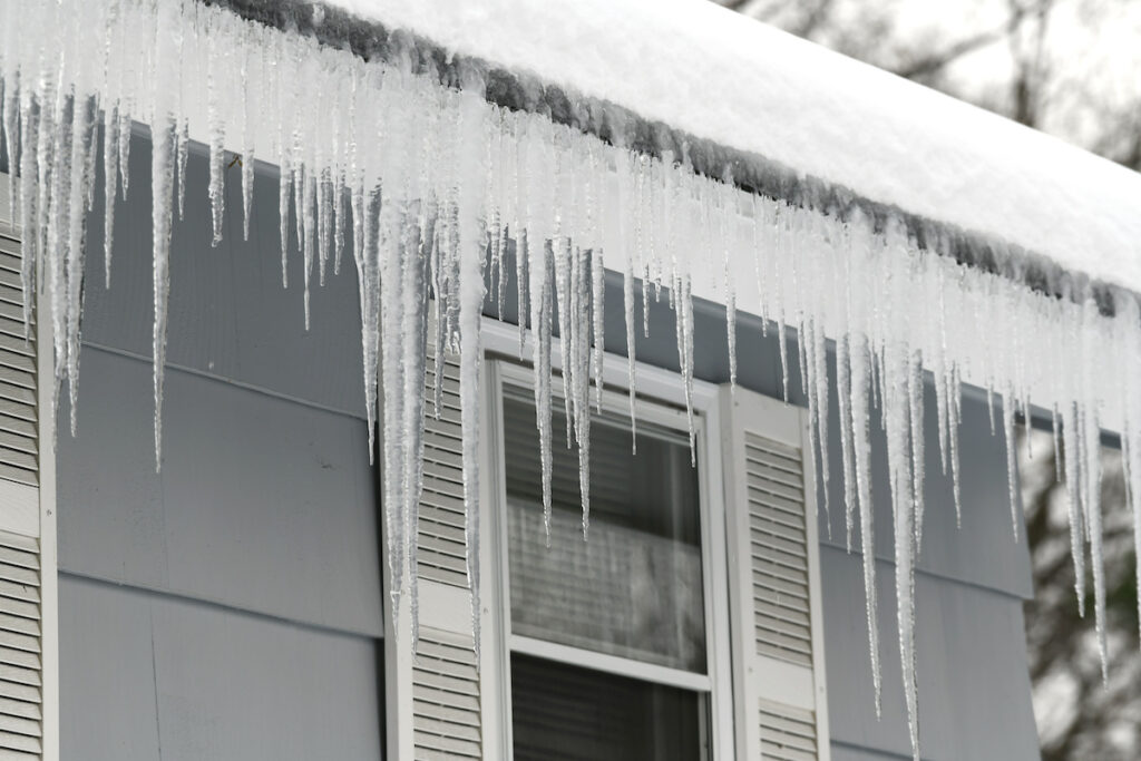 icicles and ice damming on roof eaves