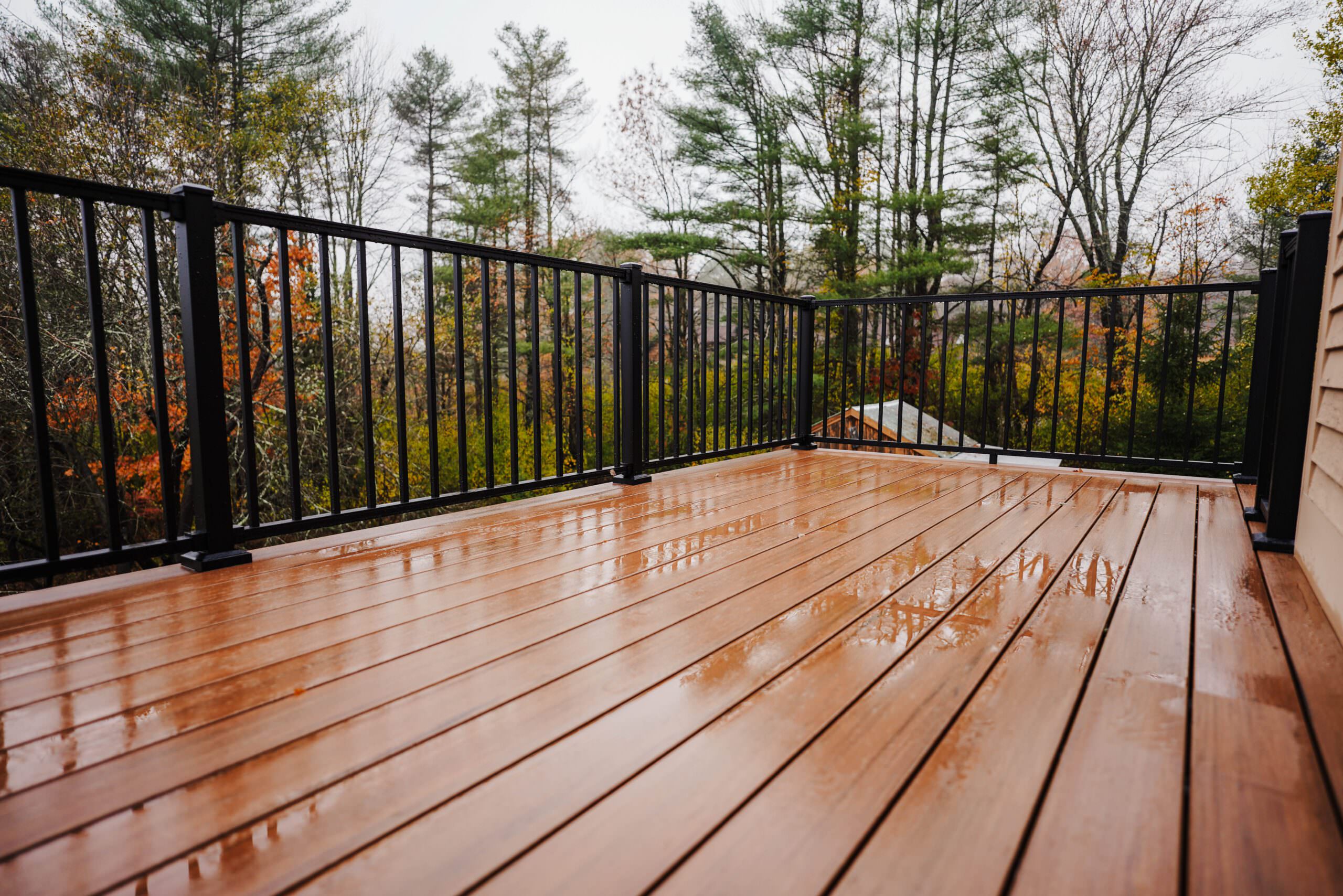 Composite decking that looks like real wood with black railings